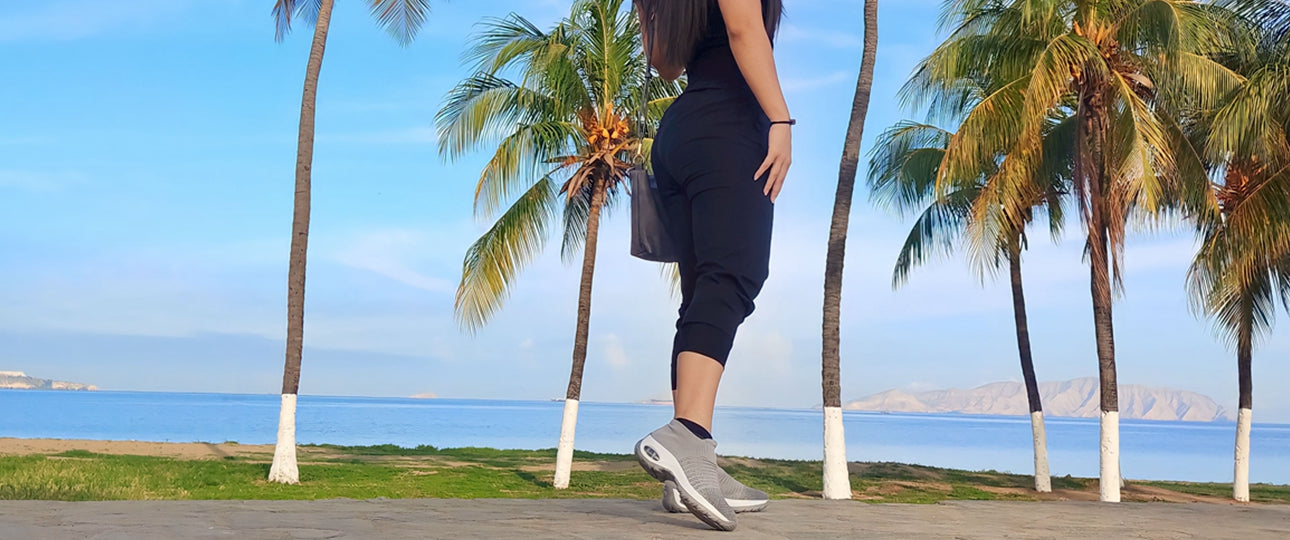 A-woman-in-stq-shoes-stands-by-the-coastal-road